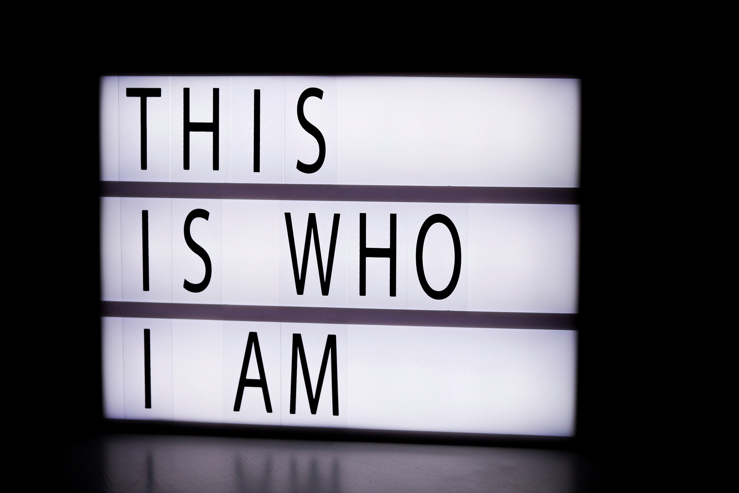 A light box with a quote that reads ‘THIS IS WHO I AM’. A light box with a quote that reads ‘THIS IS WHO I AM’.