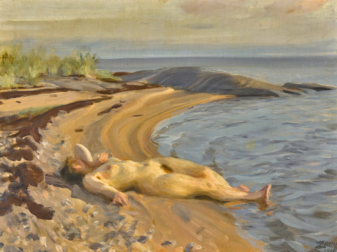 A nude woman lies stretched out on a narrow sandy beach, her body following the shoreline’s curve. One arm is raised behind her head, the other rests along her side. Her feet touch the edge of the calm water, and she appears relaxed, eyes closed, basking in the soft light. In the background, rocky outcrops and low greenery frame the quiet, hazy seascape. The brushwork is loose and warm, typical of Anders Zorn’s plein air nudes, capturing the harmony of body and landscape.