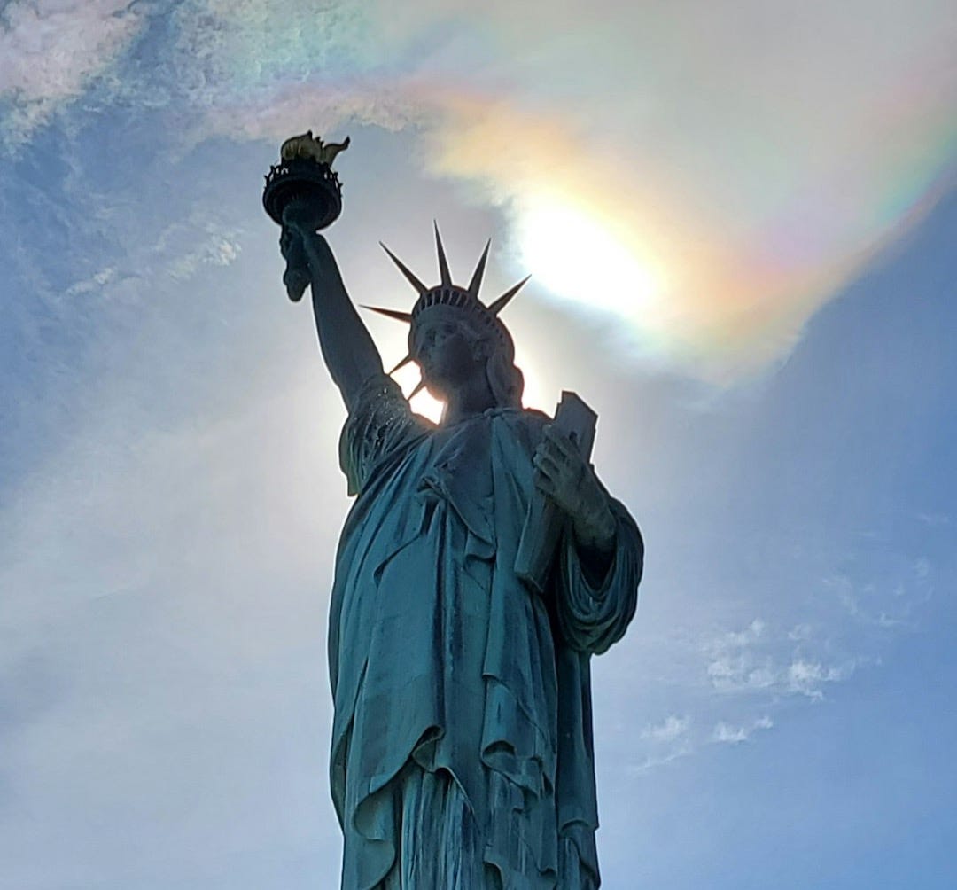 a statue of a person holding a torch