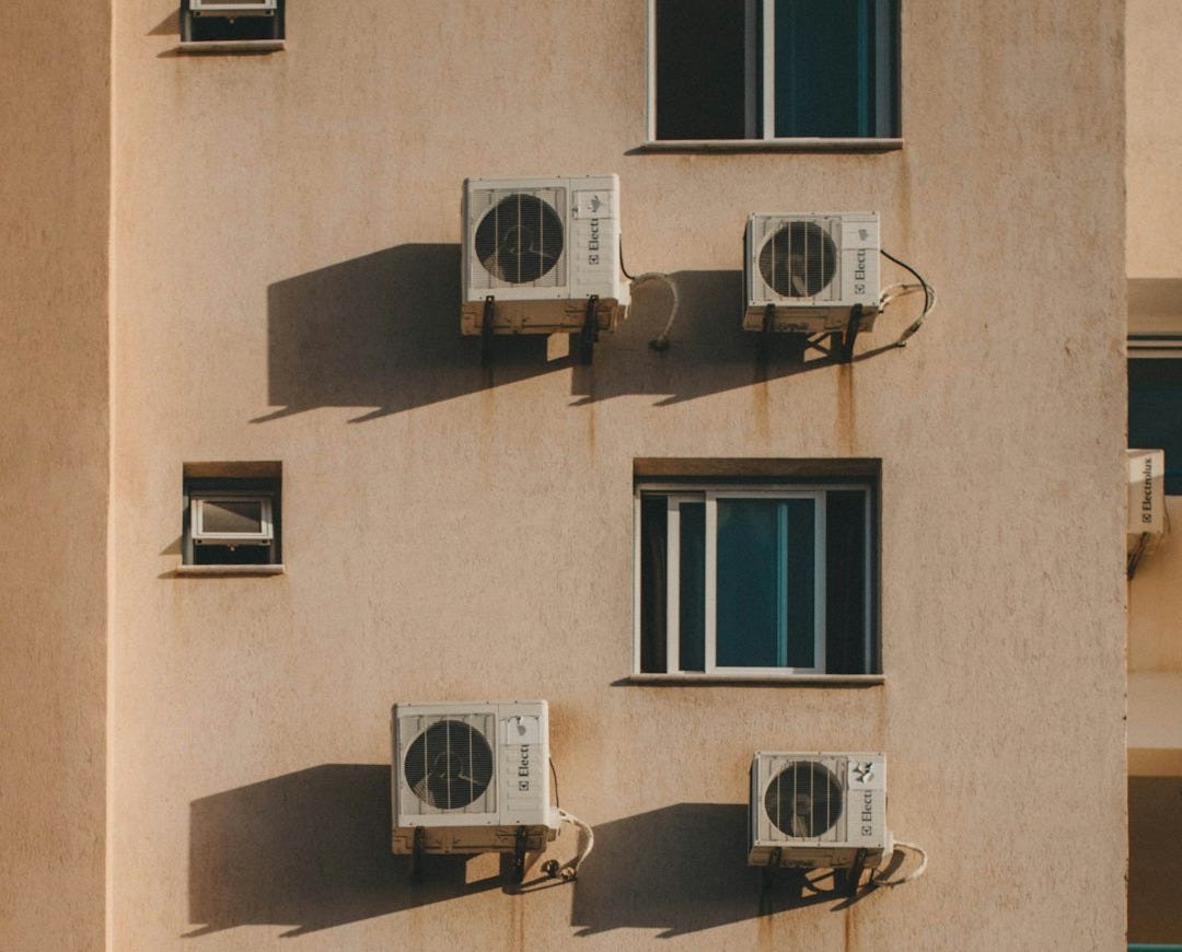 AC units mounted on wall outside building