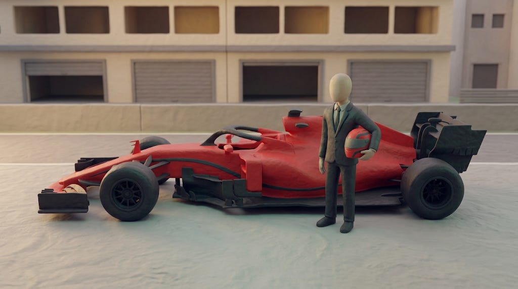 A clay figure in a suit standing beside an F1 car
