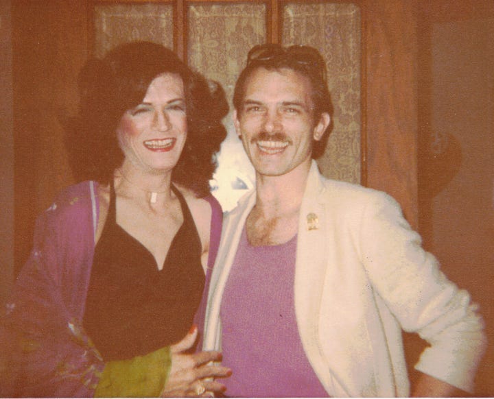Left photo: a white man in drag is on the left, and a white man with a mustache is on the right. They stand in front of a wooden door, smiling. Right photo: a ticket stub from a 1979 ABBA concert rests in a white-skinned hand.