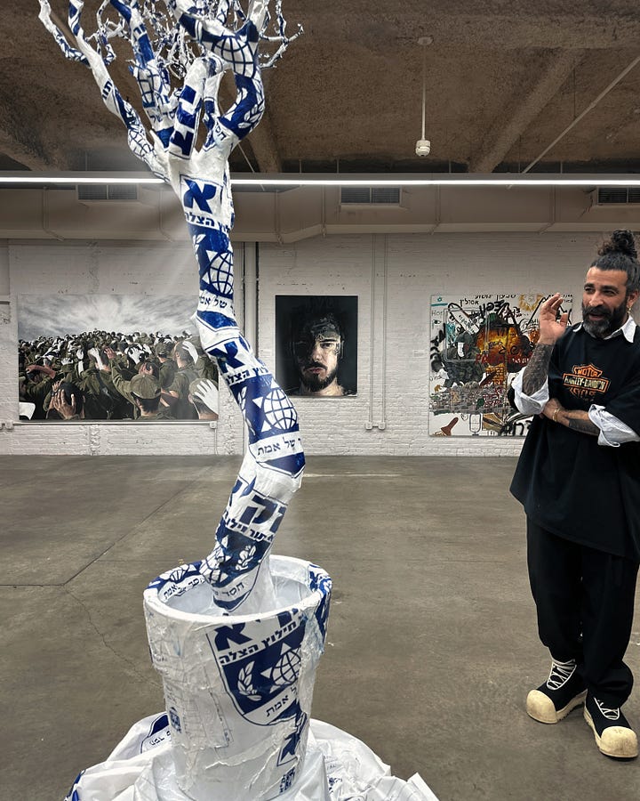 Left: A tree honoring life, formed from body bags by ZAKA volunteers who bore the weight of the unimaginable. Right: Victory (2025) created by Peretz with 15 Golani 13 Brigade soldiers who fought on October 7th. Sentiments from Rabbi Nachman and Daoism are woven throughout in Hebrew.