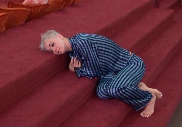 katy perry (blonde pixie cut era) lying distraught on red carpeted stairs katy perry (blonde pixie cut era) lying distraught on red carpeted stairs