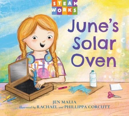 June's Solar Oven cover with a girl crafting on a table