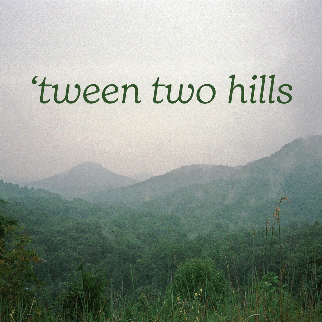 'tween two hills