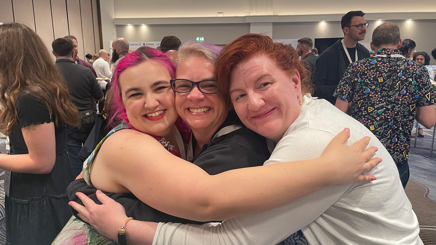 getting the hug in person from Georgianna (pink), to Kelly (purple), and Ellie (red)