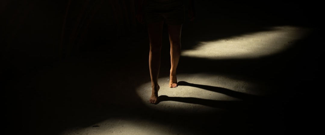 person walking on dimmed lighted room