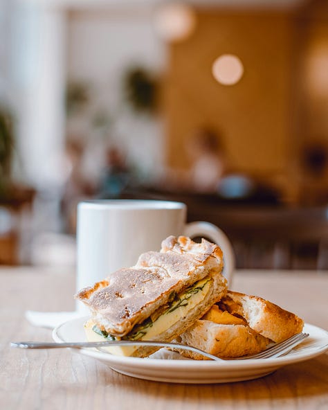 plates on table credit aleishakalina unsplash; crispy rice credit scotteckersley unsplash; noodles on fork credit alice Pasquale unsplash; burgers credit mae mu; sandwich credit tina witherspoon unsplash; pizza oven credit zero take unsplash;