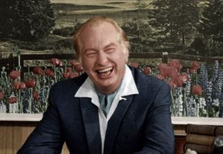 This image may contain L. Ron Hubbard Human Person Face Smile Clothing Apparel Overcoat Coat and Suit This image may contain L. Ron Hubbard Human Person Face Smile Clothing Apparel Overcoat Coat and Suit