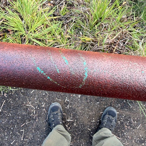 images of smiley faces painted on sidewalks and railings