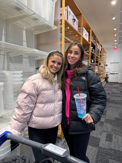 Mother and daughter shopping with college roommate visit dorm room shopping.