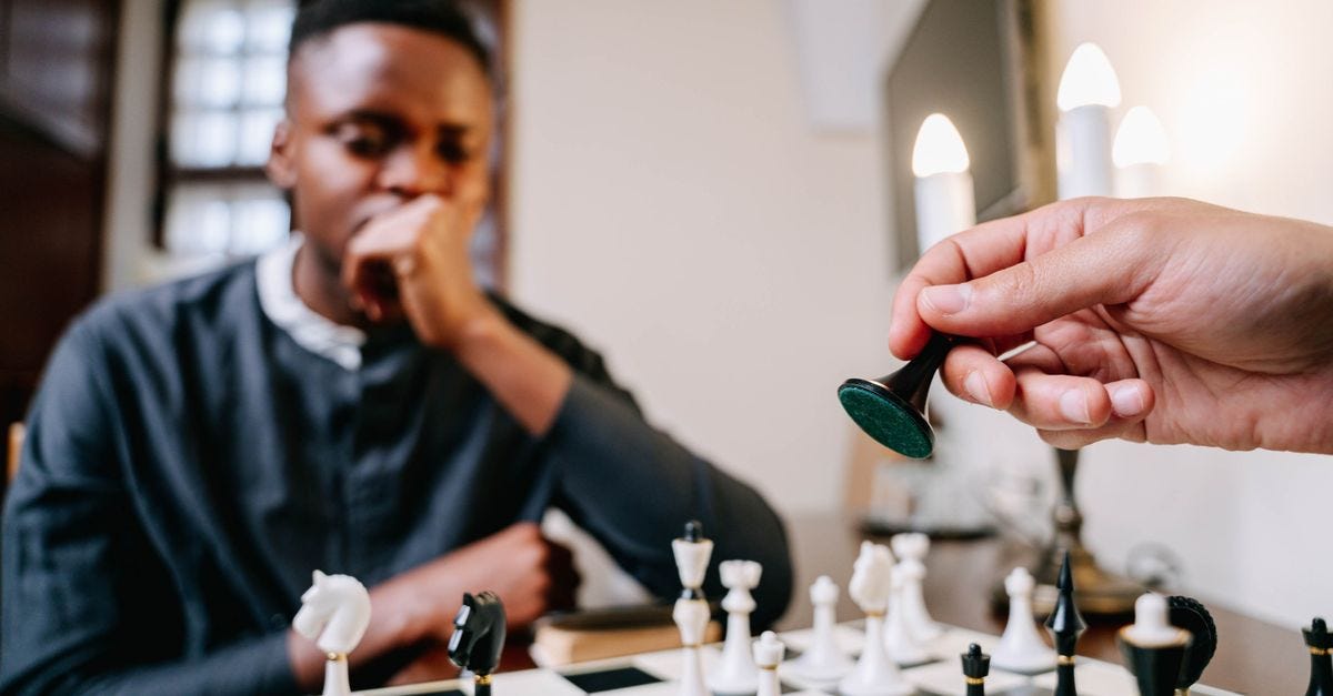 Photo: Ivan S / Pexels A strategic game of chess unfolds as a player makes a critical move indoors.