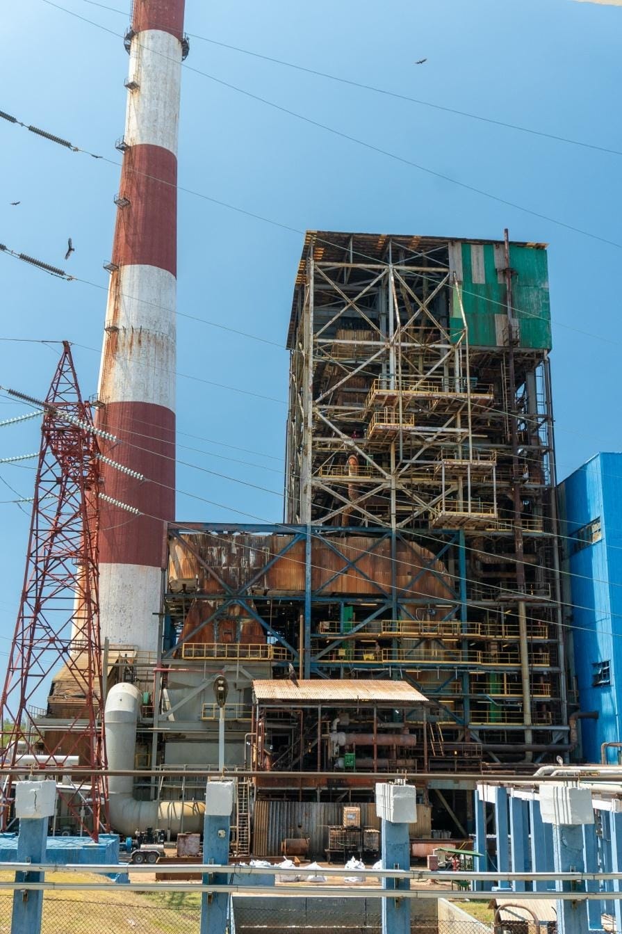 A factory with scaffolding and a red and white tower
AI-generated content may be incorrect. A factory with scaffolding and a red and white tower
AI-generated content may be incorrect.