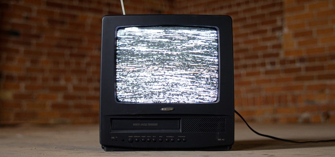 black crt tv on brown wooden table black crt tv on brown wooden table