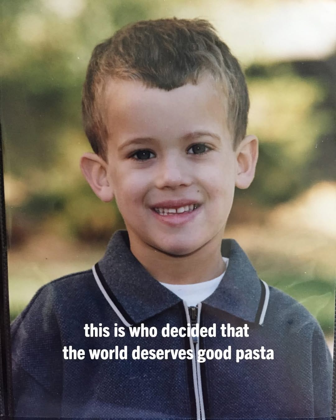 an Tecklin as a kid in a blue zip up 