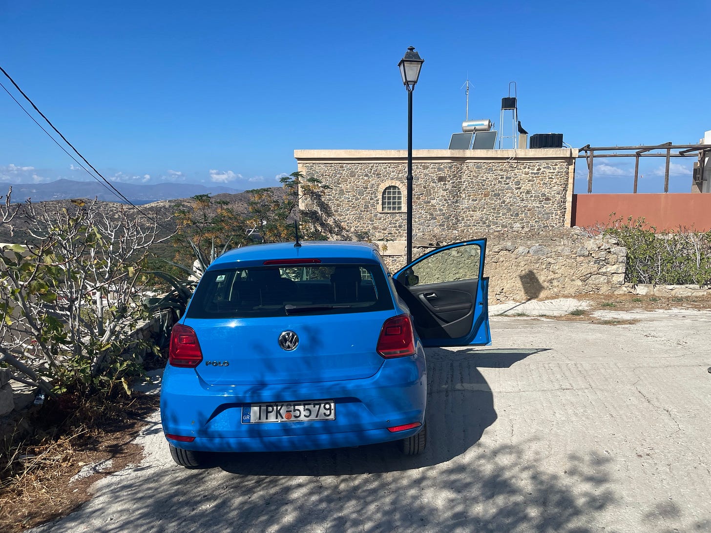 Our fun blue Polo parked by our house in Kavousi!