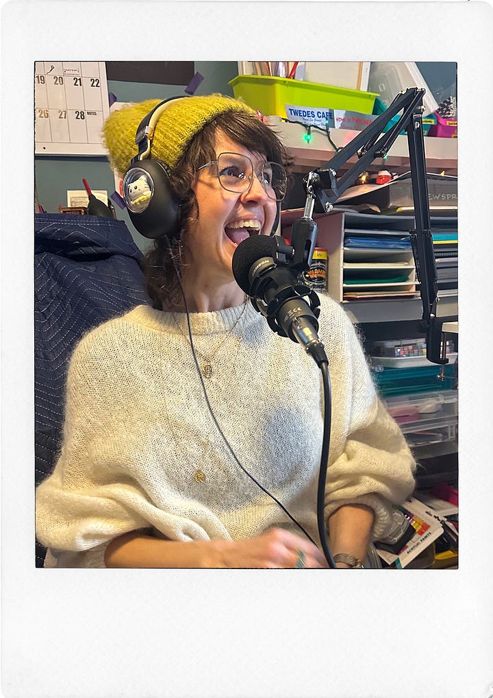 Two photos: One of Joanna, a gorgeous brunette wearing a CMU Alumni sweatshirt and holding up a coffee - next to a microphone. The other photo is of Sara K behind a microphone wearing a barf green knit hat and headphones with a cat in them, laughing about smething