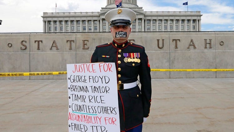 U.S. Marine veteran stands outside for hours with 'I can't breathe' taped over his mouth | 10tv.com U.S. Marine veteran stands outside for hours with 'I can't breathe' taped over his mouth | 10tv.com