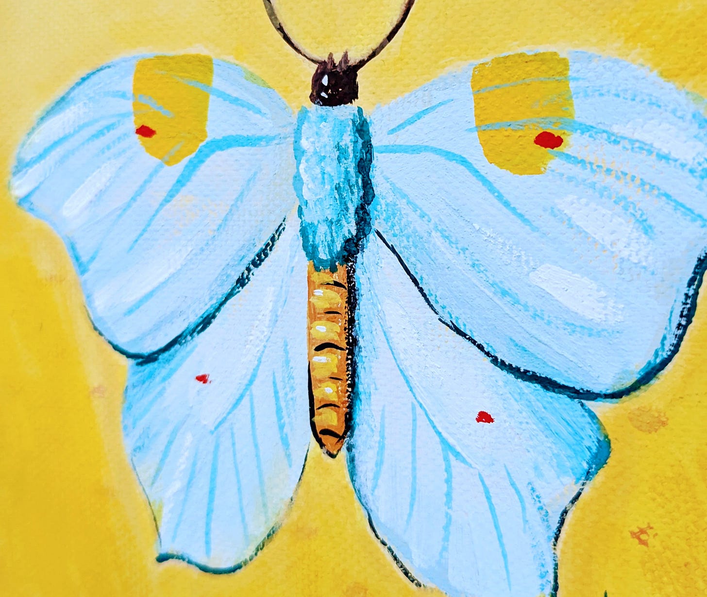 a small painting of a light blue butterfly on a yellow background