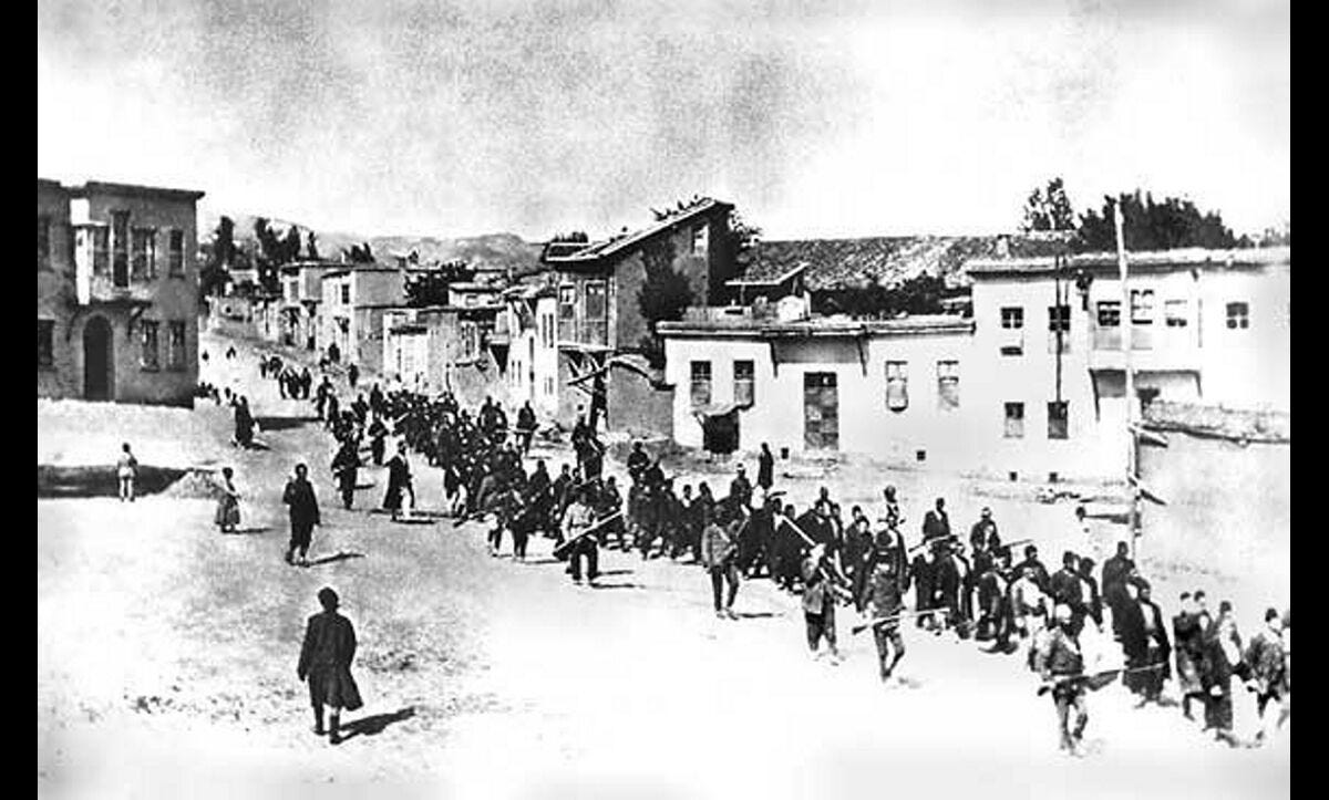 Soldiers from the Young Turk Ottoman Army escorting thousands of Armenians on lethal marches through the empire. C.1915. Soldiers from the Young Turk Ottoman Army escorting thousands of Armenians on lethal marches through the empire. C.1915.