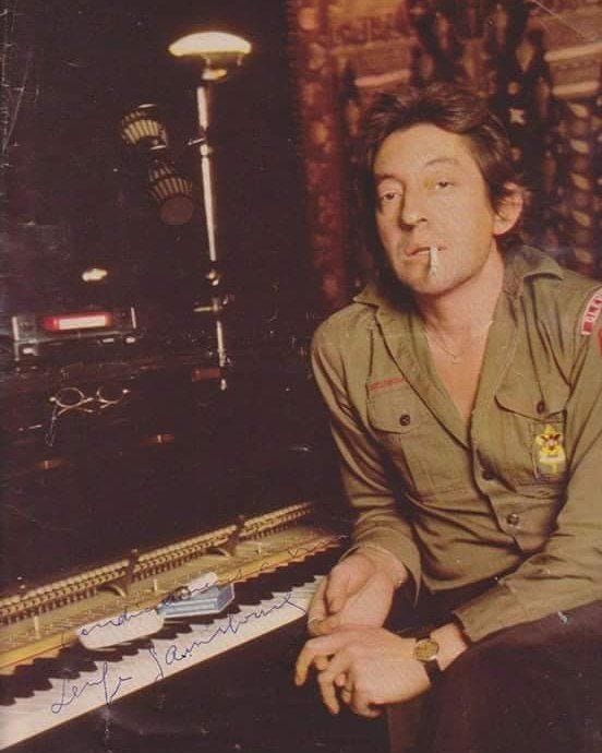 This may contain: a man sitting in front of a pipe organ with his hand on the keyboard and looking off to the side This may contain: a man sitting in front of a pipe organ with his hand on the keyboard and looking off to the side