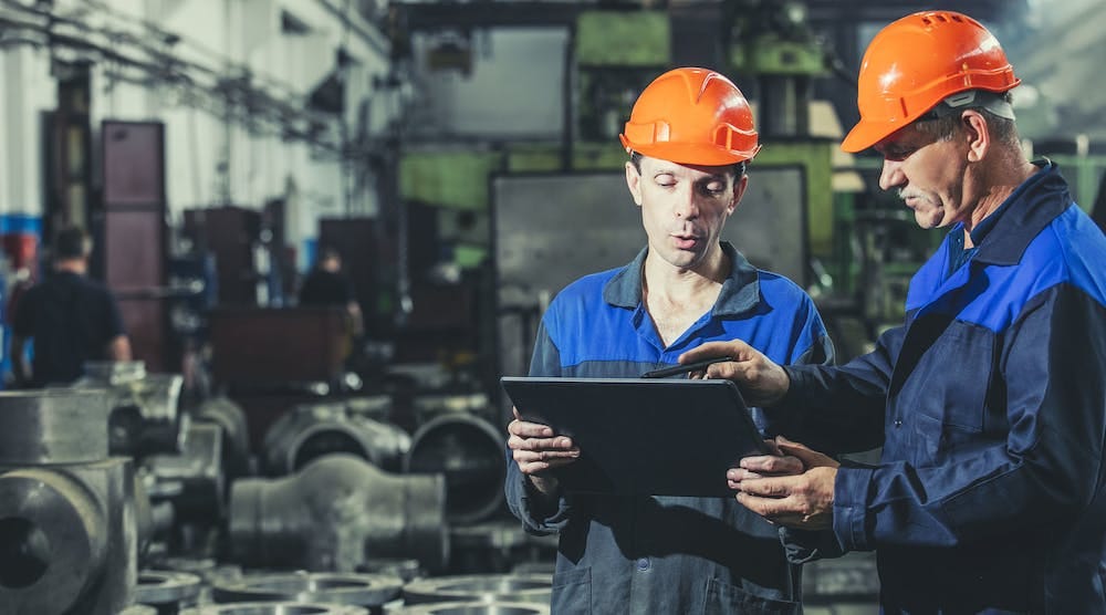 Two Helmeted Workers Tablet Evgeniia Kuzmich Dreamstime