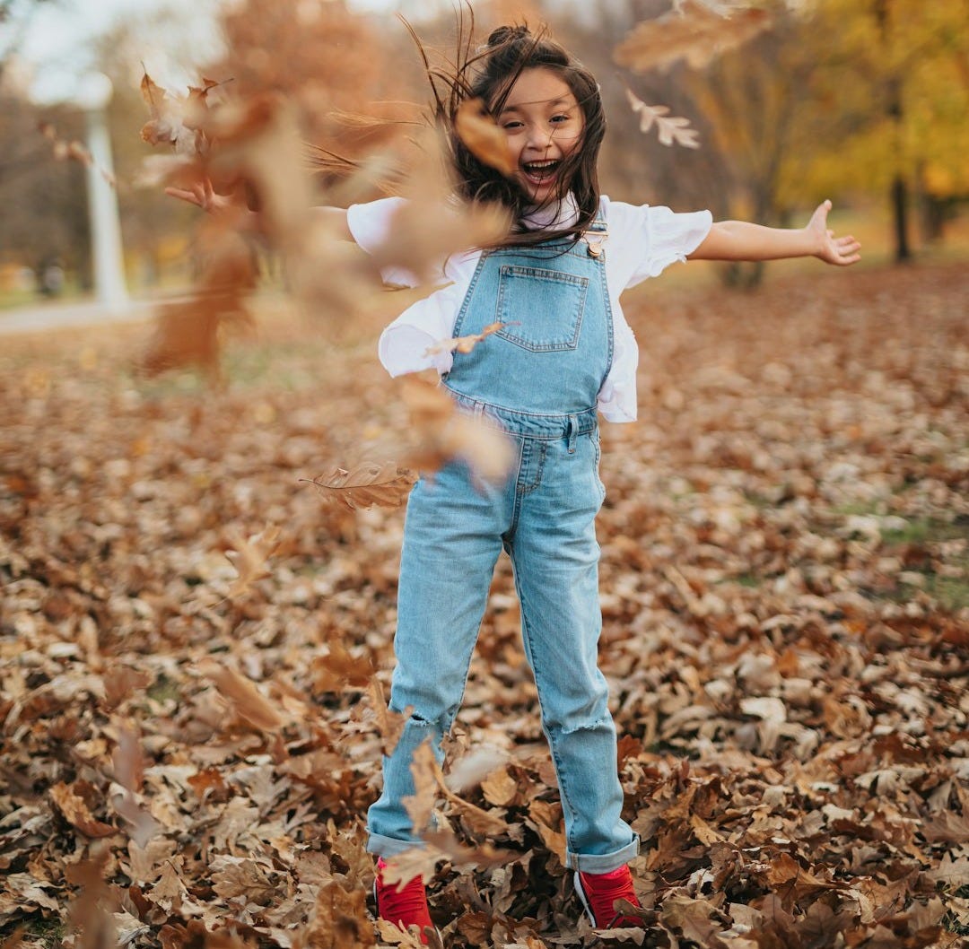 In the Dance: girl dancing in the leaves