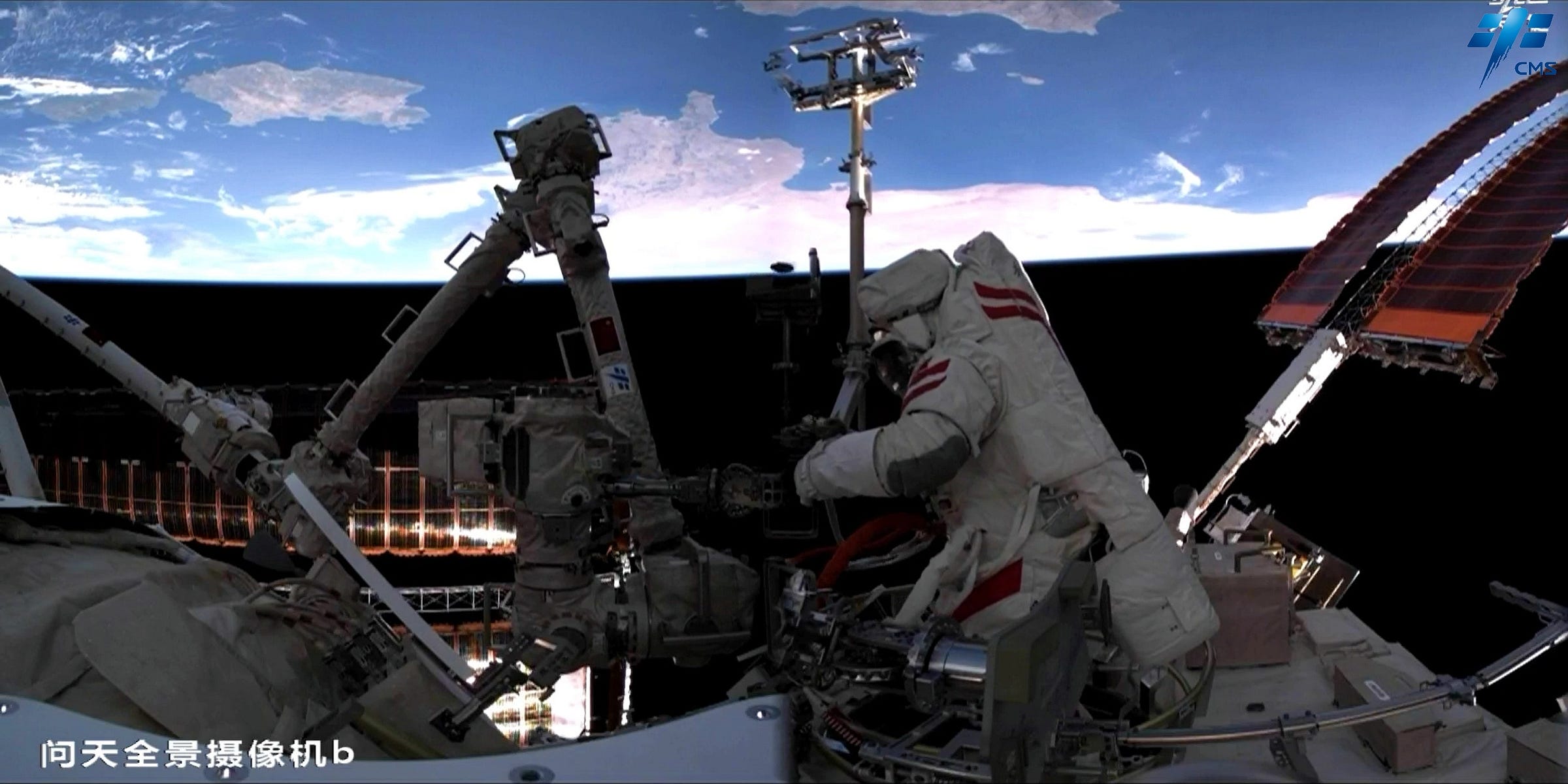 Chen Zhongrui works on Tiangong’s robotic arm just outside of the Wentian module’s airlock.