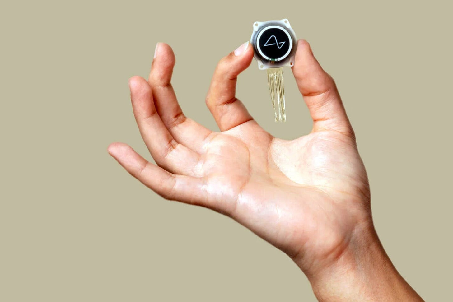 A hand holding the N1 implant.