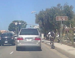 Adult bicyclist riding in the gutter Source: Dan Gutierrez