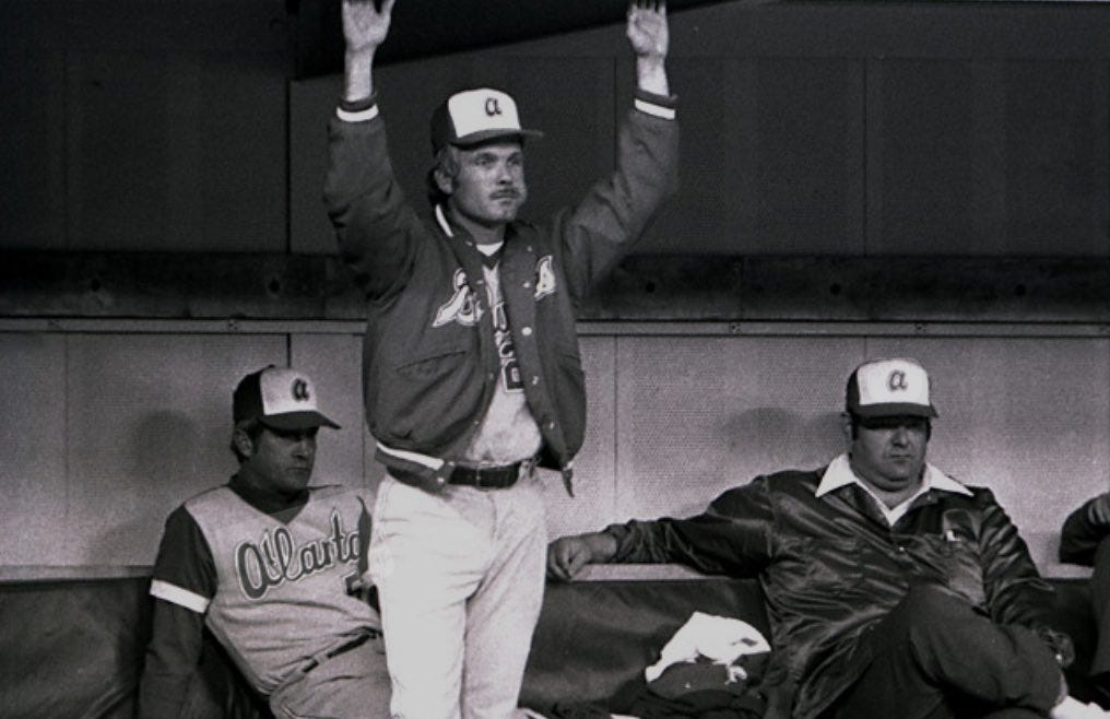 Turner in uniform, standing in the Braves' dugout.