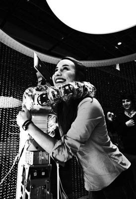 ^ Here she is hugging a robot in Tokyo