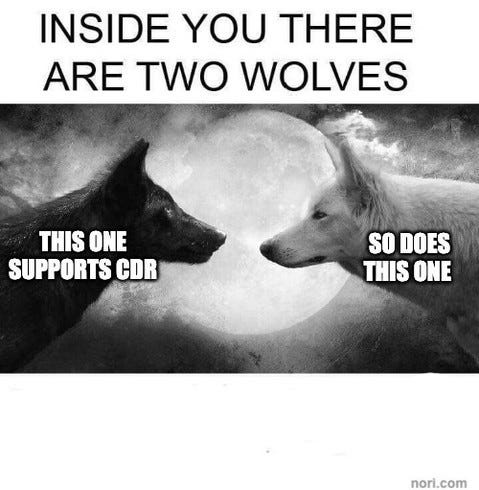 Text: "Inside you there are two wolves." Below, a black wolf and a white wolf facing each other before a full moon. "This one supports CDR." "So does this one."