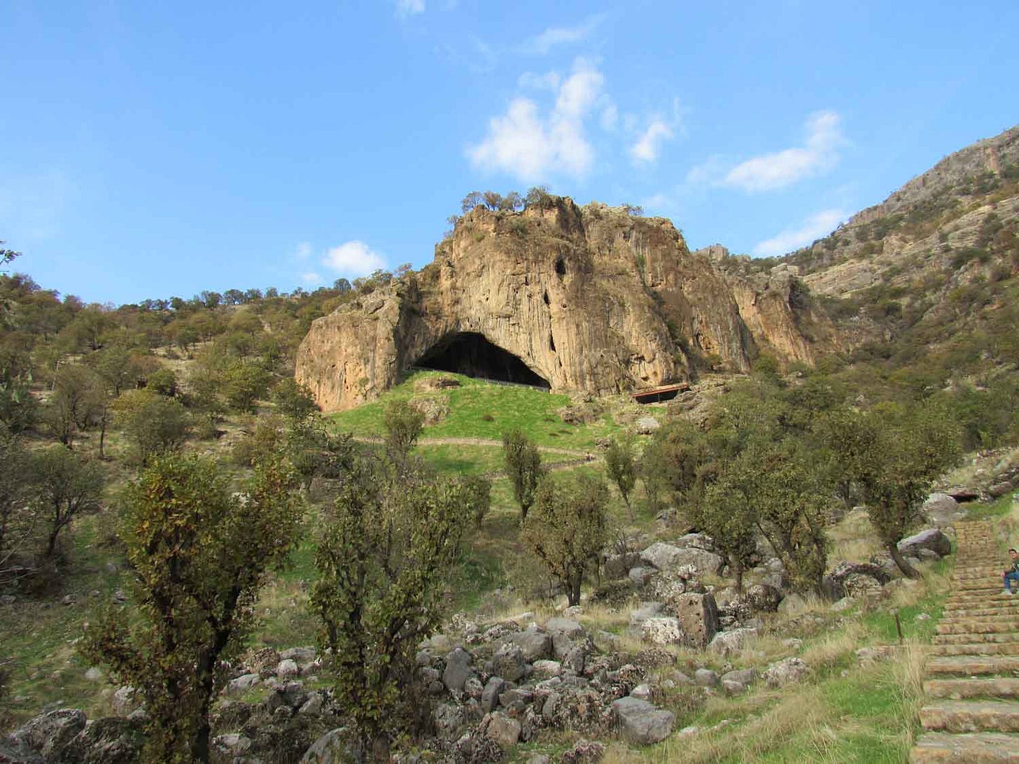 Shanidar cave in the side of a rocky hill Shanidar cave in the side of a rocky hill