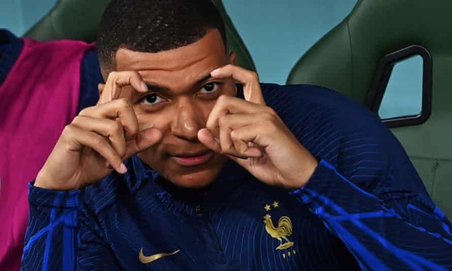 Kylian Mbappé of France makes a camera gesture back at a photographer during the match against Tunisia. Kylian Mbappé of France makes a camera gesture back at a photographer during the match against Tunisia.