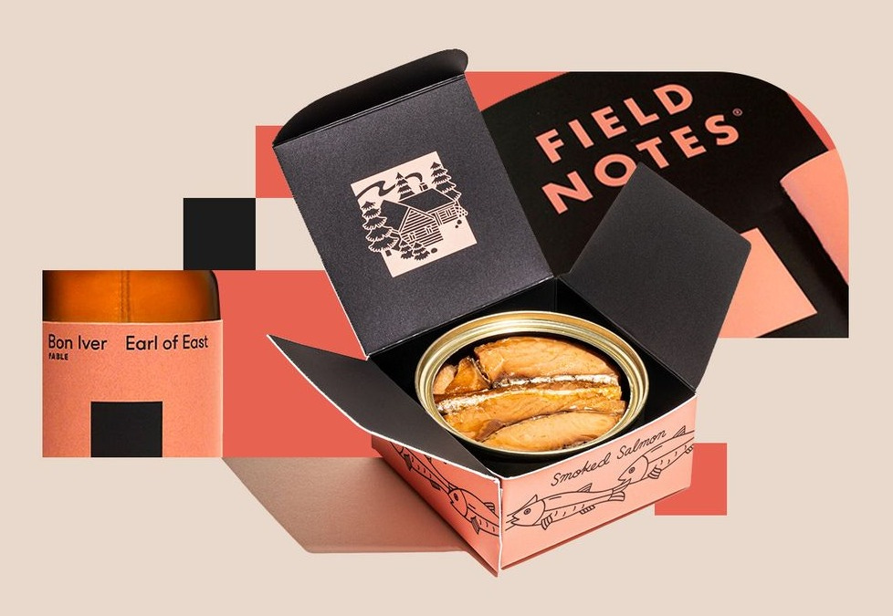 A photo collage showcasing Bon Iver-branded collaboration products, including tinned salmon, field notes, and a custom scent product. 