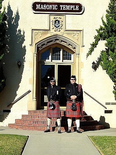 Michael R. MacFarlane (the head of the Clan MacFarlane) and Jim Hoerricks (of the Clan MacFarlane and Michael’s ghillie), Knights of St. Andrew of Scotland, attired in MacFarlane Modern tartan, formal wear. Pictured in front of a Masonic Lodge. Michael R. MacFarlane (the head of the Clan MacFarlane) and Jim Hoerricks (of the Clan MacFarlane and Michael’s ghillie), Knights of St. Andrew of Scotland, attired in MacFarlane Modern tartan, formal wear. Pictured in front of a Masonic Lodge.