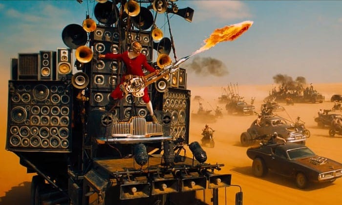 Mad Max: the story behind the flame-throwing, scene-stealing guitar guy | Mad  Max: Fury Road | The Guardian