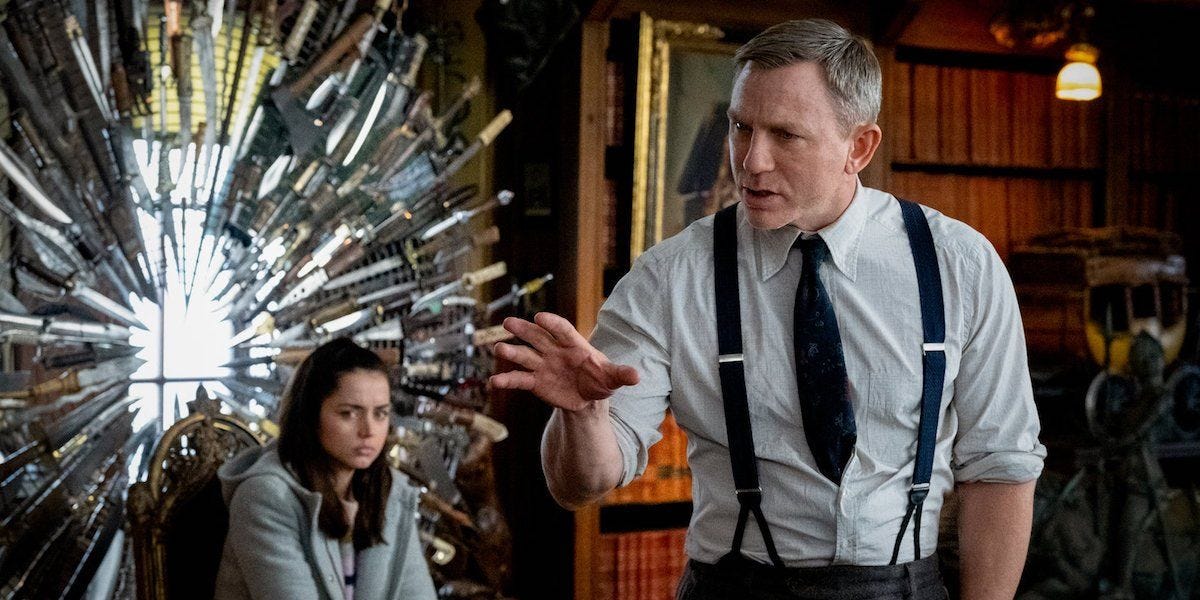 Knives Out: Benoit Blanc explains his reasoning while Marta Cabrera sits in the knife chair. Knives Out: Benoit Blanc explains his reasoning while Marta Cabrera sits in the knife chair.