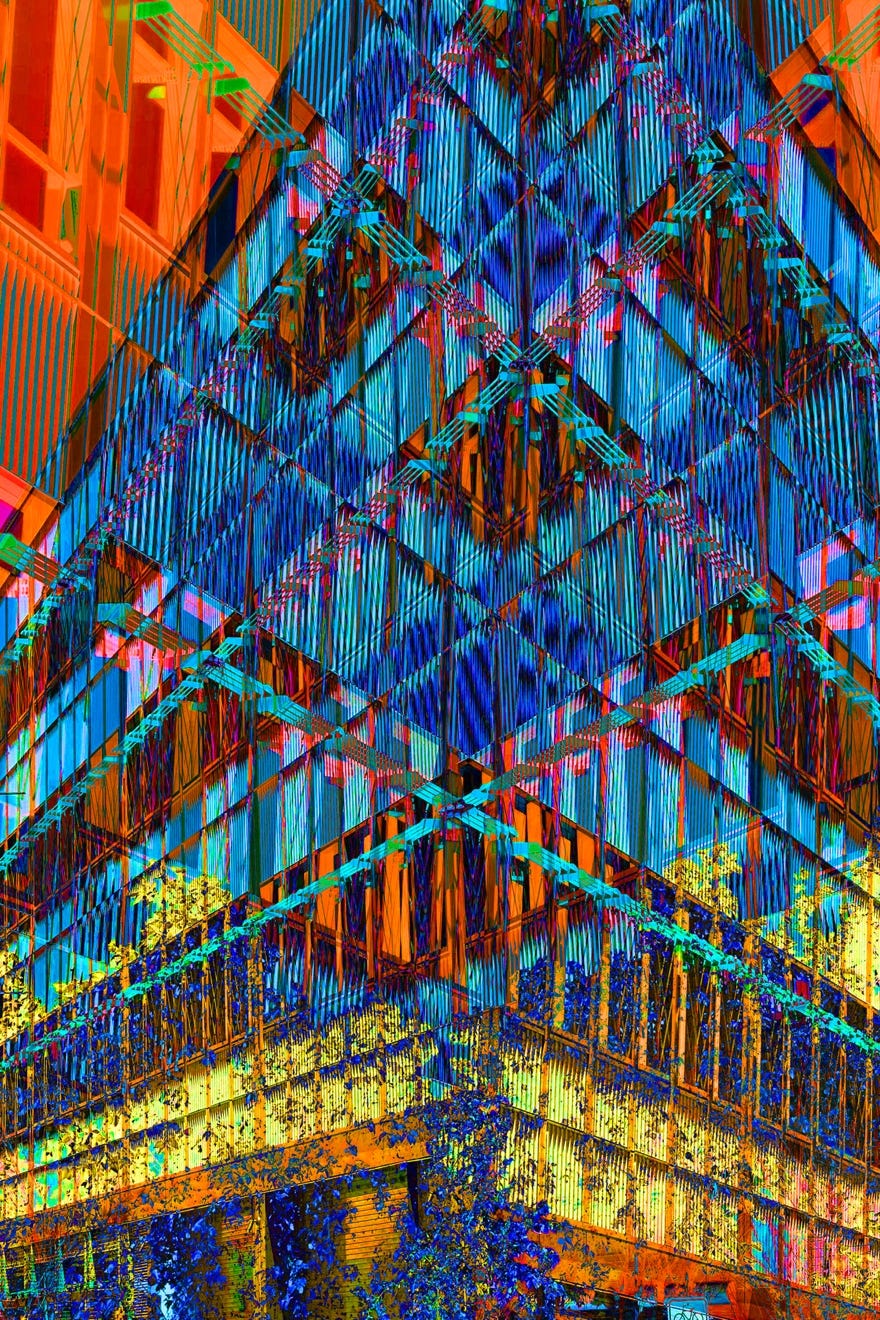 A multicolored building with many windows

Description automatically generated