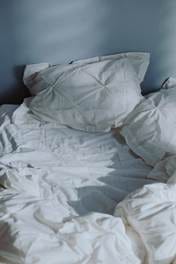 Crumpled white bedsheets.