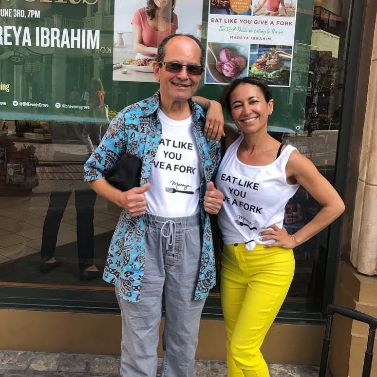 Chef Mareya and her father wearing "eat like you give a fork" shirts