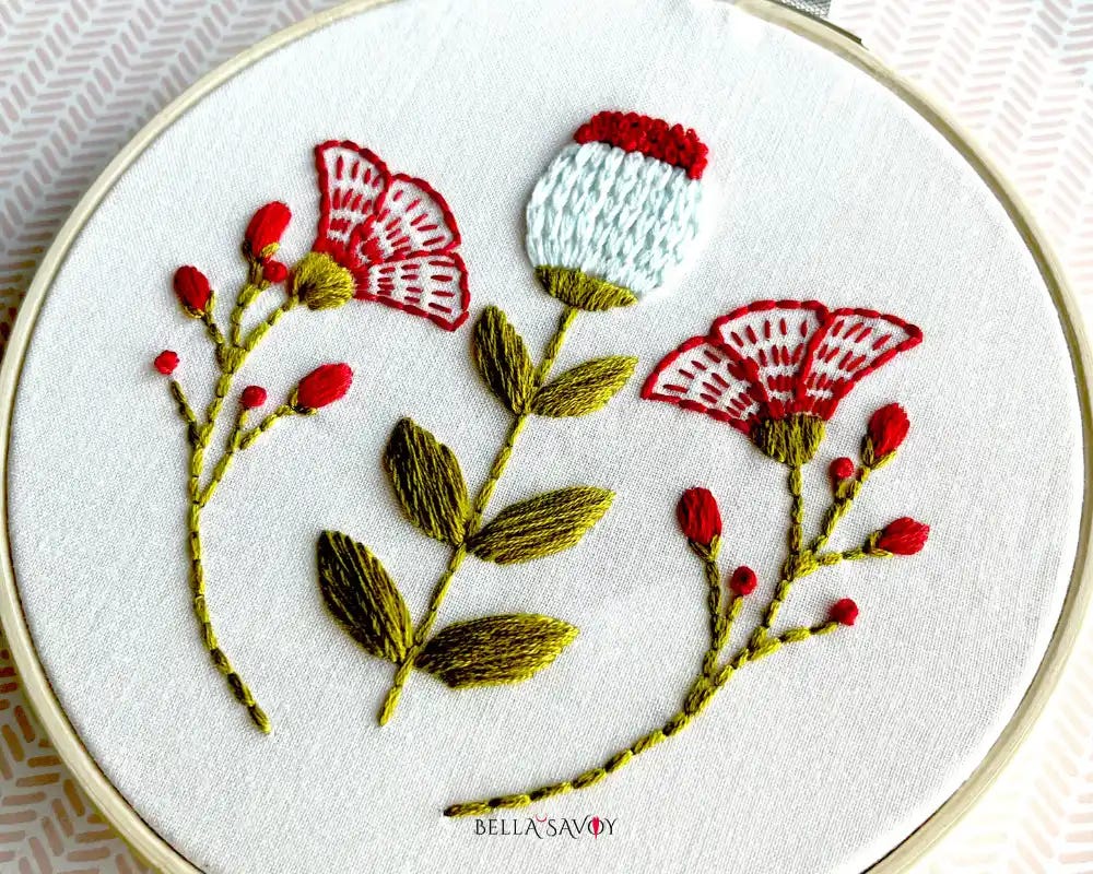 Scandinavian floral embroidery design on a hoop created with 5 basic embroidery stitches