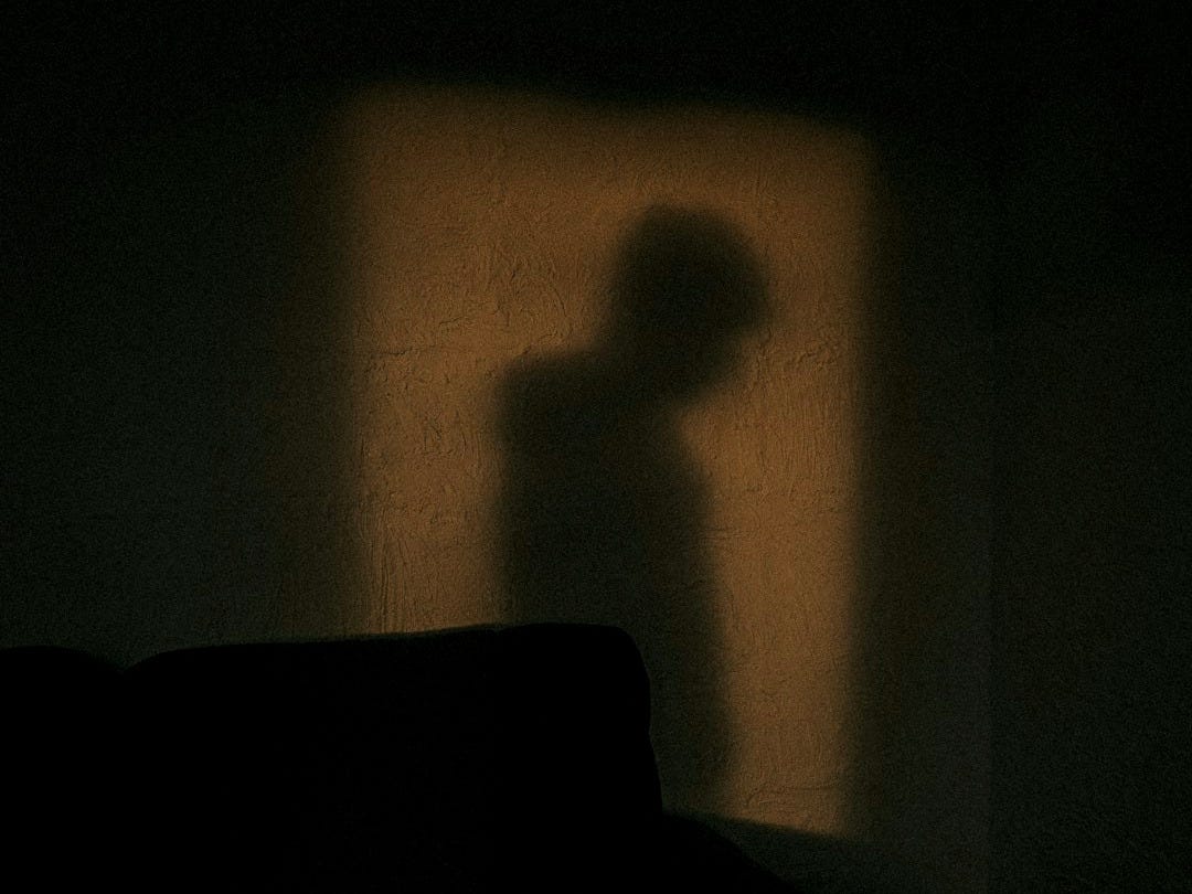 black sofa chair near white wall