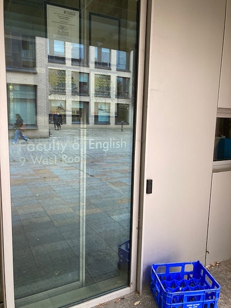 Red leaves in foreground over the river; distant view of Kings Chapel; carpet of leaves under a big tree; English Faculty sliding door; entrance to SIdgwick Buttery; sign at entrance to Petty Cury, a pedestrian street in central Cambridge