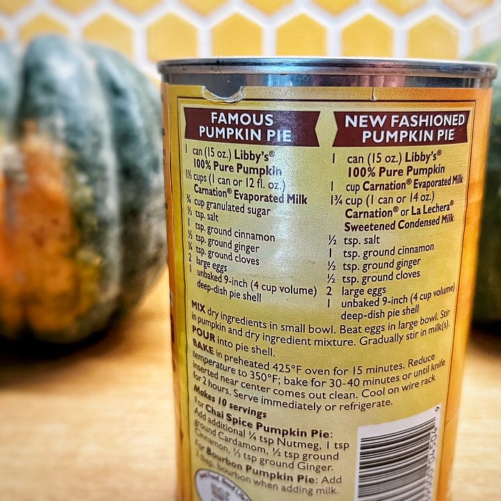 Can of pumpkin, with an image of pumpkin pie in the front, and two recipes for pumpkin pie in the back.