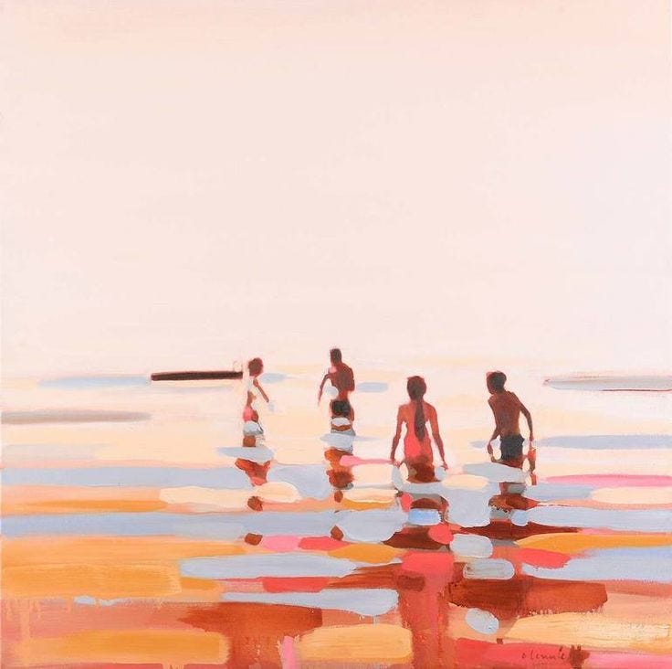 This may contain: some people are walking in the water with their surfboards