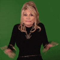 Dolly Parton indicating 'Who knew?'