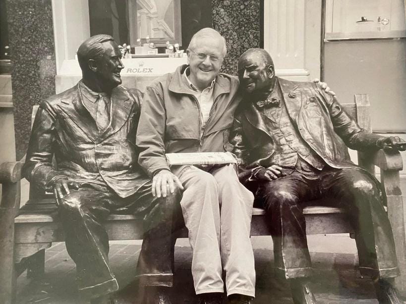 A group of men sitting on a bench

Description automatically generated with medium confidence